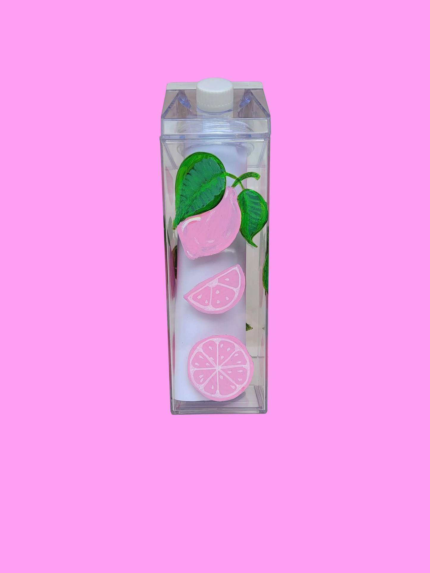 Pink lemons on milk bottle