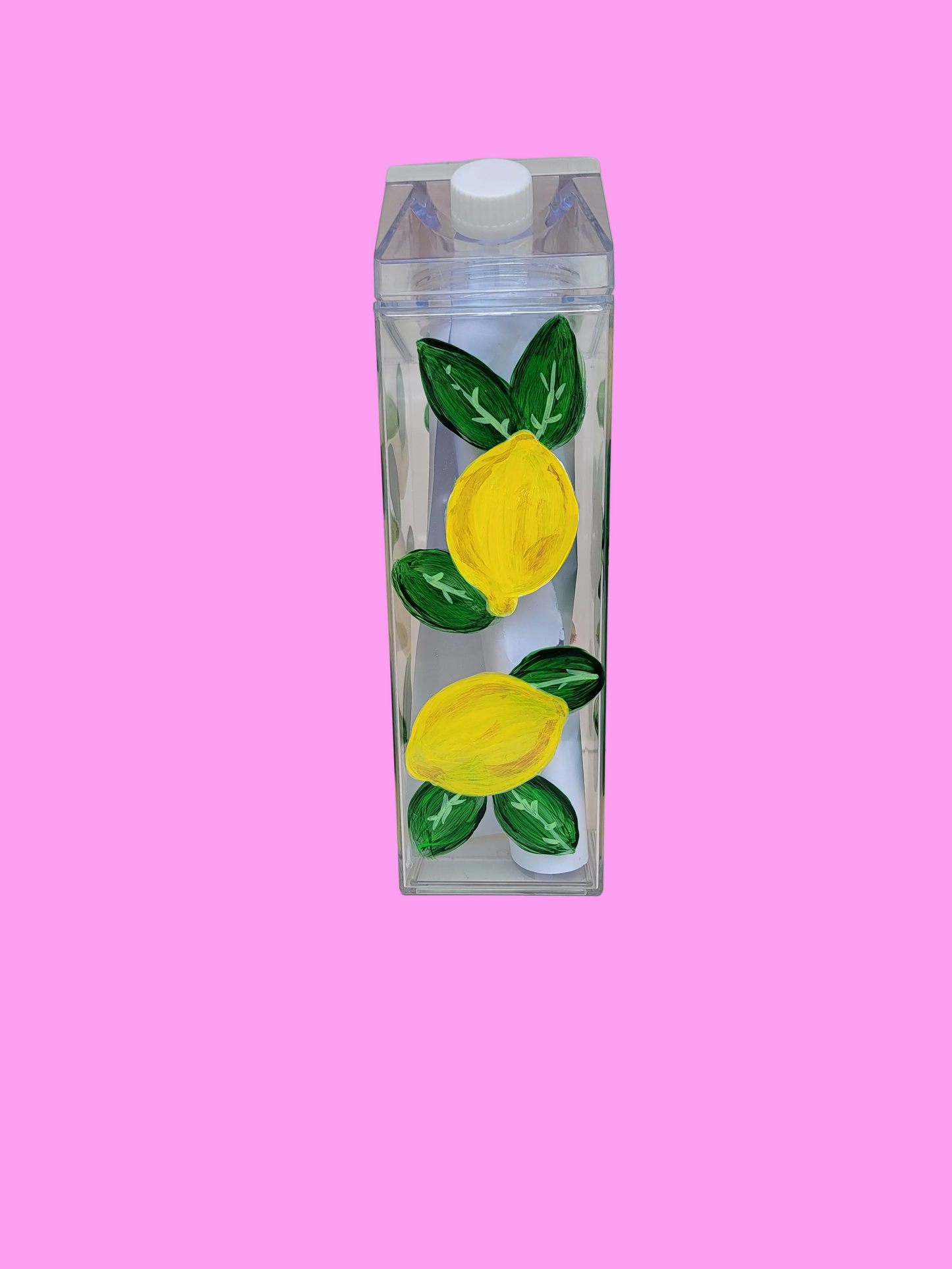 Yellow lemons on milk bottle
